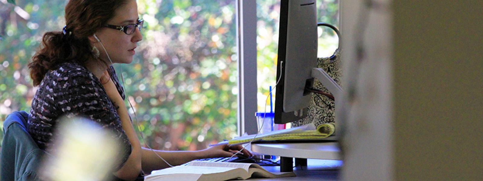 In this photo, a CIU student is using one of the computers in the computer lab.